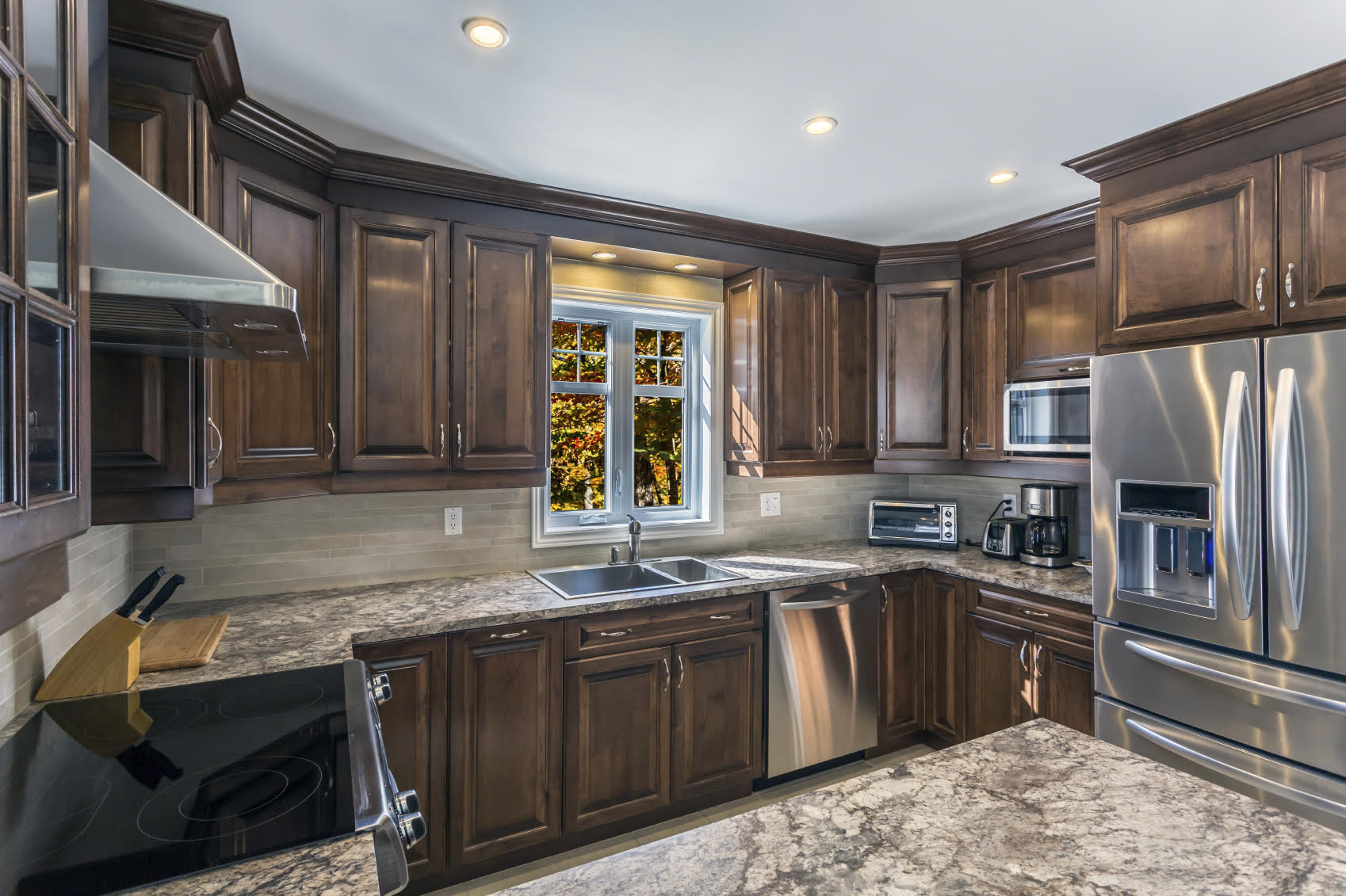Modern kitchen ovens with stainless steel finish and digital controls